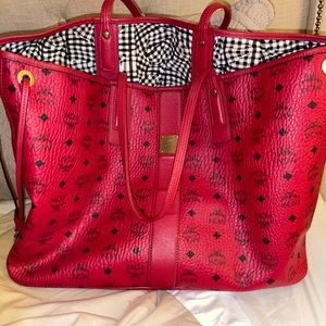 Large Mcm tote gently used/duster included. Bag is in great condition